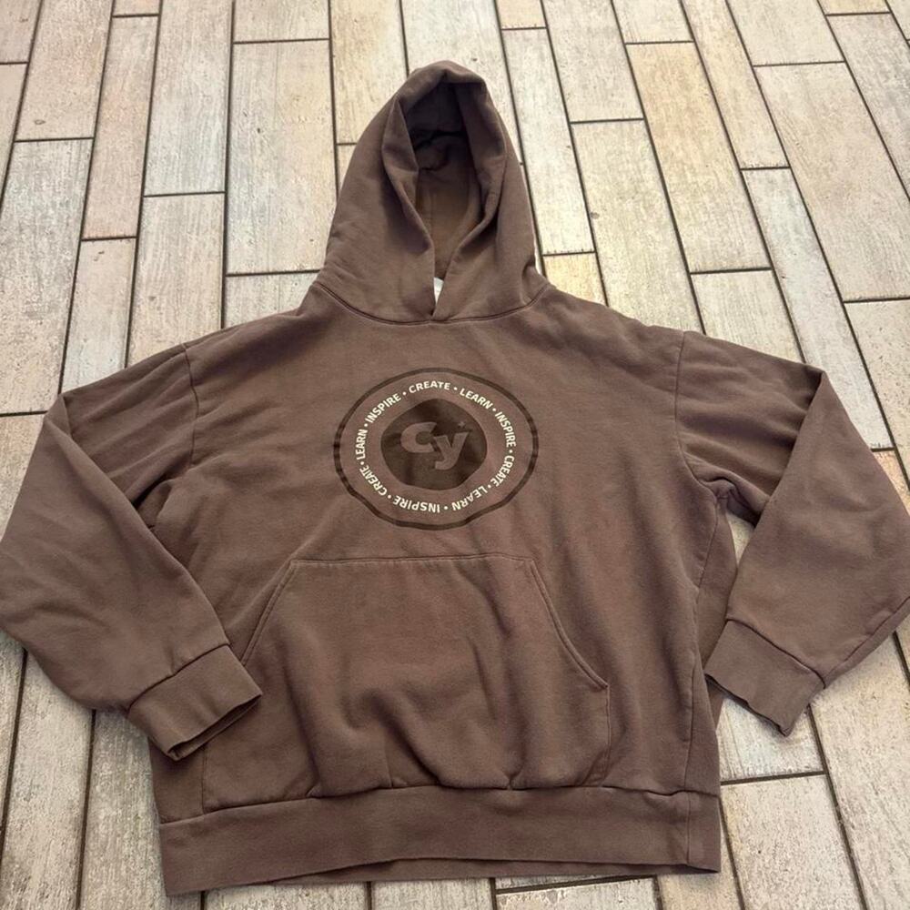 CLI Conservatory Brown hoodie with circular logo featuring 'CY'